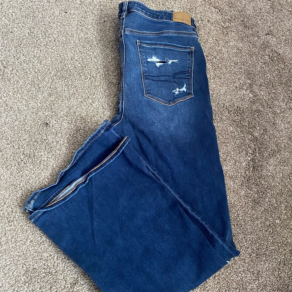 American eagle flare jeans with rips in the knee